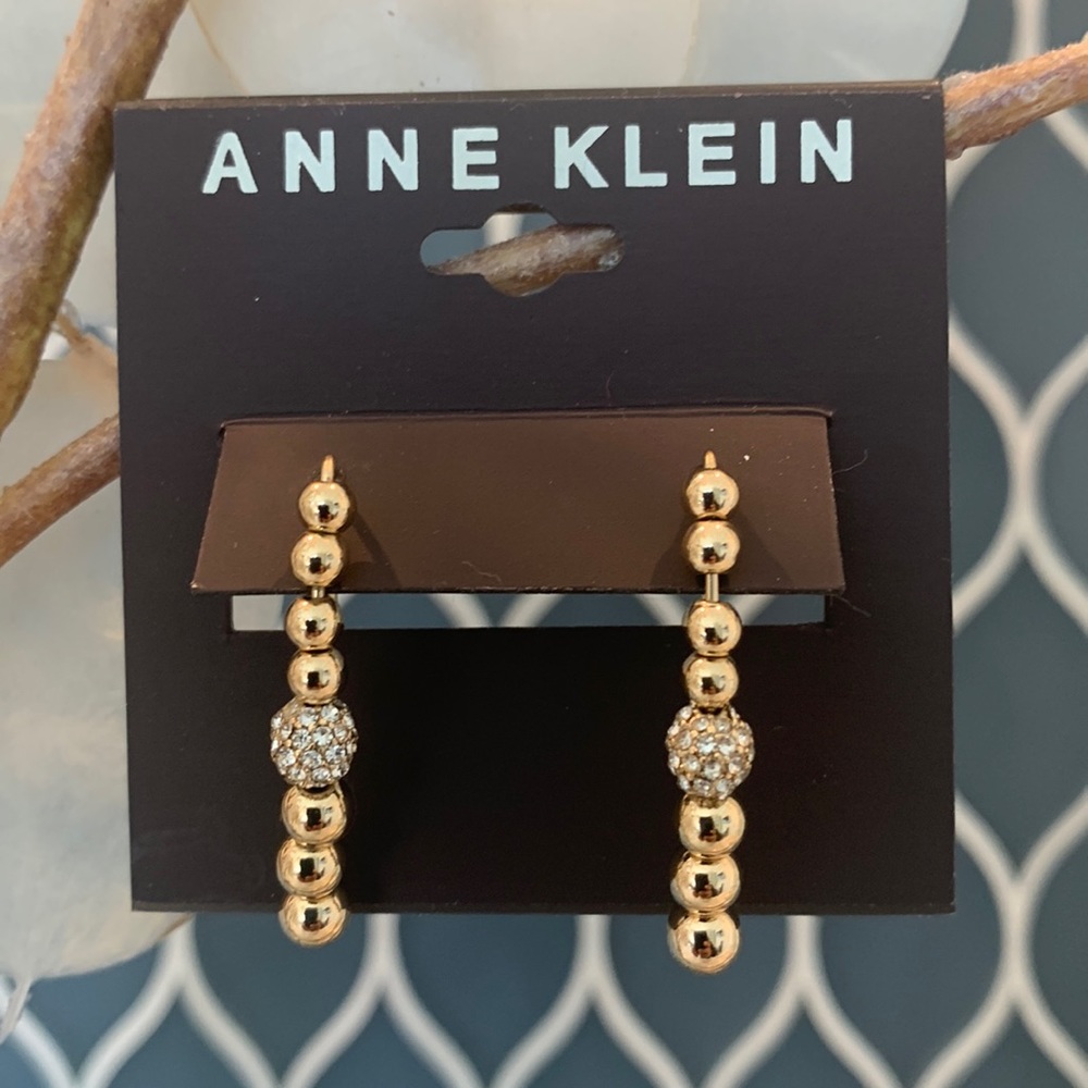 Anne Klein fashion earrings. Good toned with a cz ball in the middle.